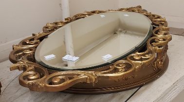 A vintage Aisonea gilt resin ornate console table with glass top and scroll support - sold with an