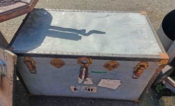 An old lift-top transit trunk