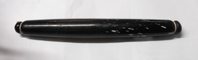 A Victorian Nailsea style bottle glass rolling pin with white enamel fleck decoration