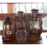 Two old hurricane lamps with glass shades - sold with an extra shade and a modern candle lamp