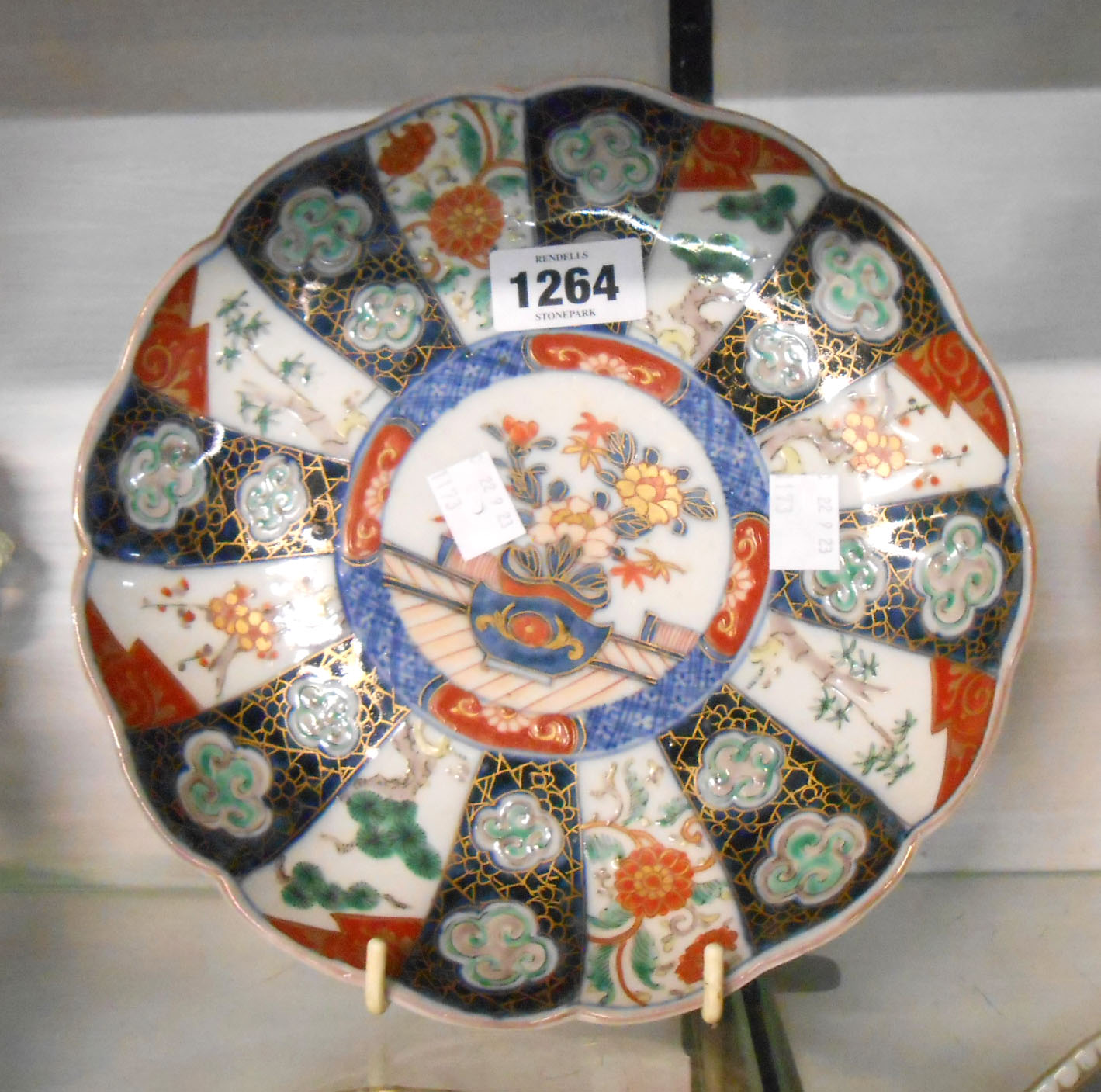 A 19th Century Japanese Imari plate of lobed form with enamelled decoration