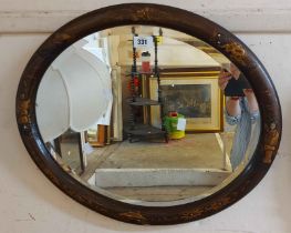 A 57cm antique chinoiserie framed bevelled oval wall mirror with flanking raised figures and other