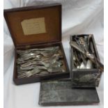 A tin and box containing a quantity of assorted silver plated cutlery including grape scissors,