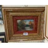 An early 20th Century ornate gilt framed and velvet slipped oil on card, depicting a woodland