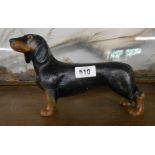 A modern painted cast-iron dachshund pattern door stop