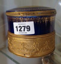 An early 20th Century continental porcelain musical box with lift-top lid and gilt metal fittings