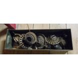 A box containing a quantity of old oil lamp burners