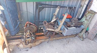 A large old lathe with cast-iron legs, frame and carriages, cutting and turning fittings, motor,