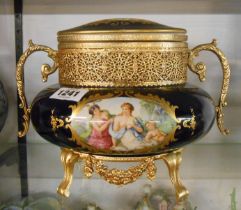 A Limoges porcelain lidded box with hand coloured transfer printed decoration and gilt metal