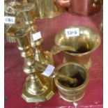 A small quantity of assorted brassware including candlesticks, pestle and mortar, etc.