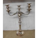 A silver plated copper twin branch three light candelabrum with detachable top section