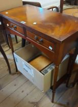 A 67cm reproduction mahogany and cross banded hall table with two frieze drawers, set on slender