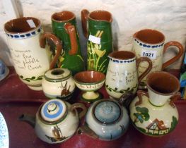 A quantity of Torquay pottery items including jugs, vases, etc. - various makers including Watcombe,