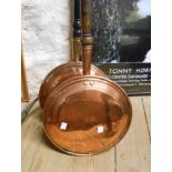 A 19th Century copper warming pan with engraved bird decoration - sold with another plain example