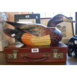 A modern painted carved wood decoy style duck model - sold with a small vintage suitcase
