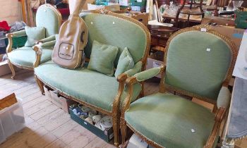 An antique style giltwood part show frame three piece suite comprising a 1.41m two seater settee and