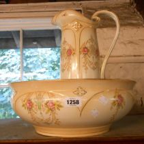 An early 20th Century Crown Devon toilet jug and bowl with typical decoration