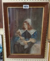 An oak framed watercolour portrait of a Tudor style young woman sitting on a bed and reading a book