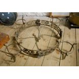 A wrought iron hanging ceiling lamp of round form with applied heraldic emblems