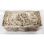 A 9.5cm continental silver box with cherub scene to hinged lid and all round Rococo embossed