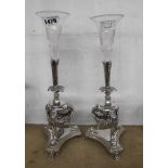 A pair of antique silver plated epergnes, each with single wheel cut glass trumpet vase, set on