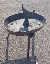 An antique cast-iron boot scraper - sold with a similar trivet