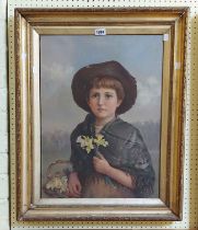 A gilt framed early 20th Century oil on canvas portrait of a child holding a basket of flowers