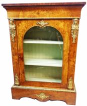 A 19th Century inlaid walnut pier cabinet with flanking applied brass figural capitals and other