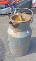 A small vintage metal milk churn