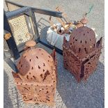 A pair of metal garden lanterns in the Moroccan style - sold with a quantity of old hurricane lamps