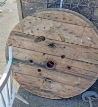 A pair of large wooden cider press wheels