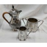 A harlequin three piece silver plated tea set