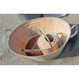An old galvanised tin bath - sold with a similar watering can