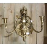 An early 20th Century gilt bronze three branch candle wall sconce, with cast cherub and urn