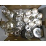 A box containing a quantity of silver plated items including egg cruet, toast rack, butter dish,