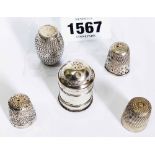 An antique white metal nutmeg grater and barrel pattern shaker - sold with two silver thimbles and a