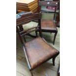 A set of four antique mahogany framed standard chairs with scroll backs and leather upholstered