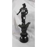 A French spelter figure depicting a man sowing grain set on ebonised wood plinth with antique patina
