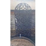 A French wrought iron three fold dressing screen with pierced scroll decoration