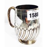 A Victorian silver christening mug with engraved decoration, initials and semi-reeded design -