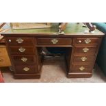A 1.28m 19th Century mahogany kneehole desk with green leather inset top, three frieze drawers and