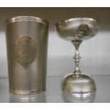 A cased communion set comprising large beaker and double ended chalice with engraved initials - case