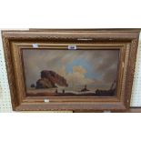 A gilt framed antique oil on canvas, depicting a coastal view with rocks in foreground