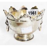 A small silver pedestal bowl with flanking lion mask ring handles and decorative cast rim - dents