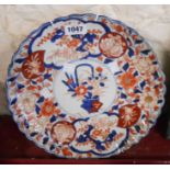 A 19th Century Japanese Imari charger with typical painted decoration