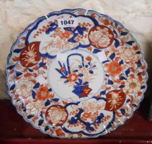 A 19th Century Japanese Imari charger with typical painted decoration