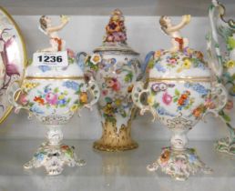 A 19th Century bone china lidded jar with flower encrusted and hand painted decoration with