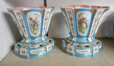A pair of small French porcelain Sevres style jardinieres and stands of lobed form with decorative