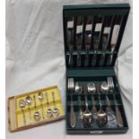 A cased set of stainless steel cutlery - sold with a boxed set of apostle coffee spoons