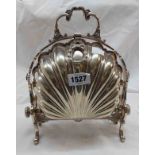 An antique silver plated folding muffin dish of clamshell design, set on cast standard ends